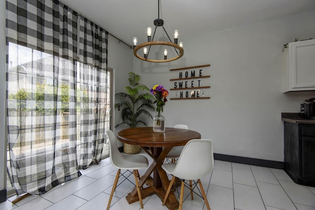 tiled dining space with a notable chandelier