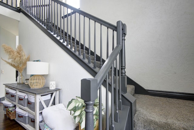 stairs with hardwood / wood-style flooring and plenty of natural light