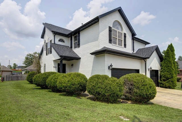 view of front of house featuring a garage and a front yard