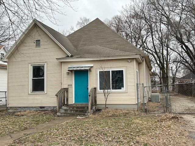 view of front of house featuring cooling unit