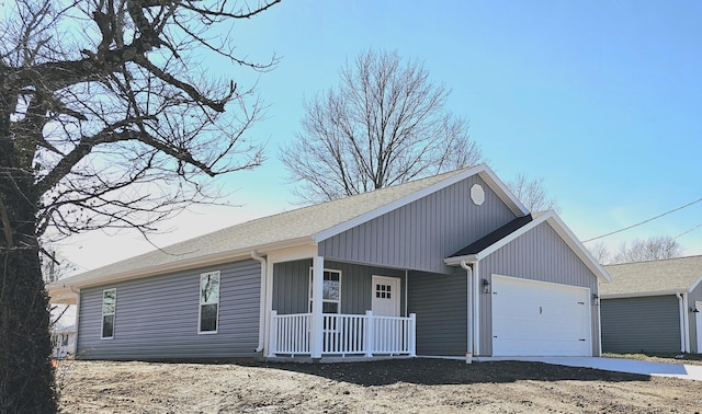 ranch-style home with a garage and a porch