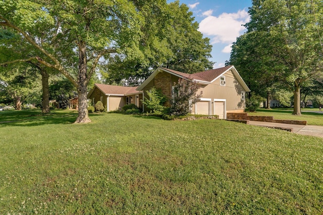 view of front of house with a garage and a front yard