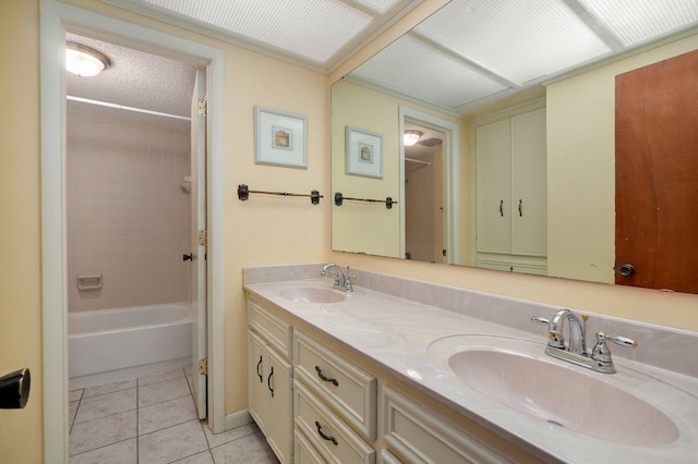 bathroom featuring vanity, tile patterned floors, and tiled shower / bath