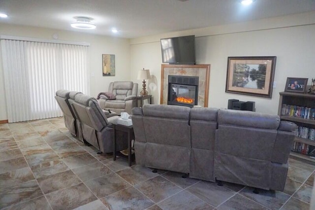 living room with a tiled fireplace