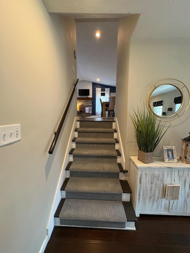 staircase featuring wood-type flooring