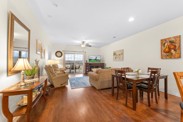 living room with wood-type flooring and ceiling fan