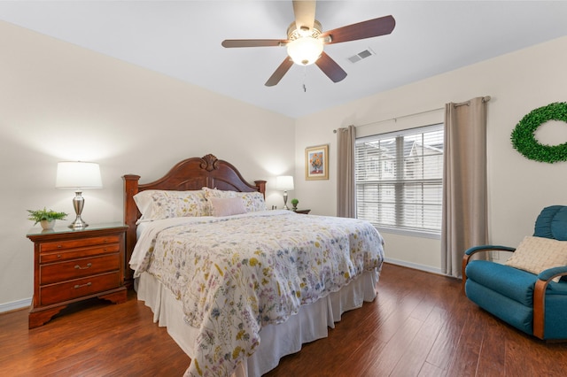 bedroom with ceiling fan and dark hardwood / wood-style flooring