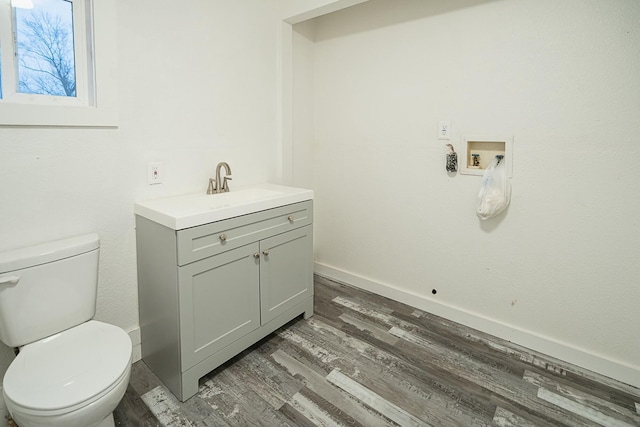4229 County Road 2120, Pomona, MO 65789 - bathroom featuring vanity, toilet, and wood-type flooring