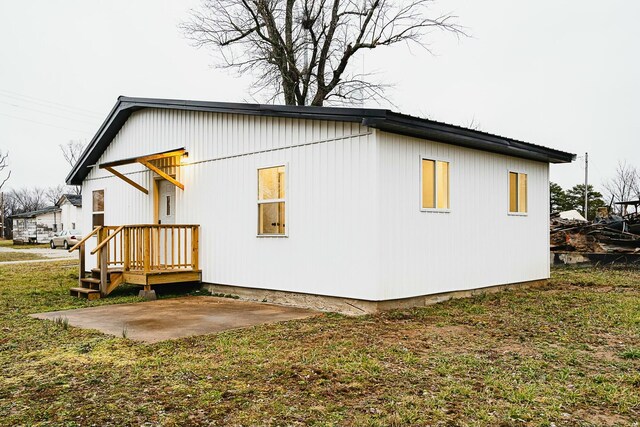 4229 County Road 2120, Pomona, MO 65789 - view of side of home featuring a yard and a patio