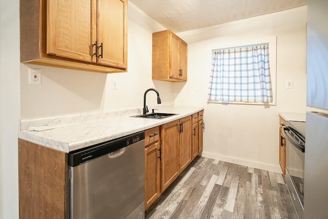 4229 County Road 2120, Pomona, MO 65789 - kitchen with electric stove, sink, dishwasher, light hardwood / wood-style floors, and a textured ceiling