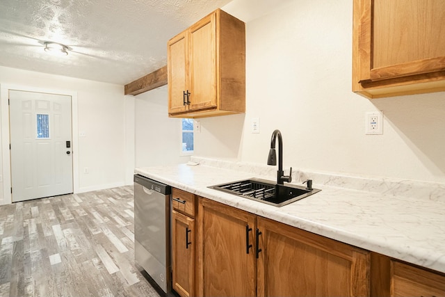 4229 County Road 2120, Pomona, MO 65789 - kitchen with sink, light wood-type flooring, stainless steel dishwasher, light stone counters, and a textured ceiling