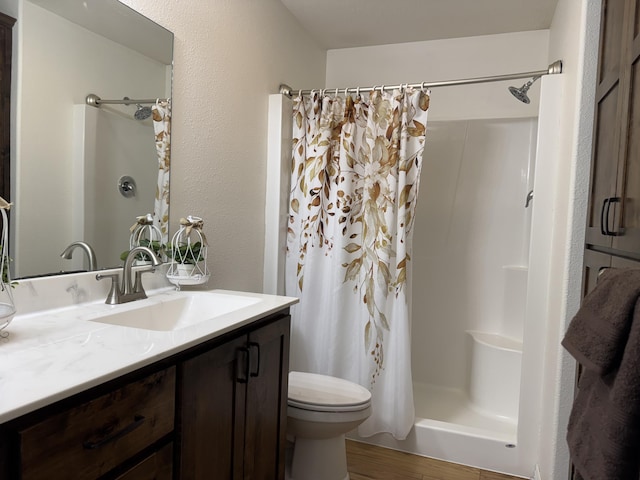 bathroom with vanity and walk in shower