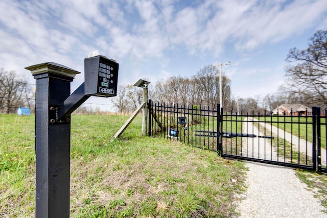 view of gate with fence