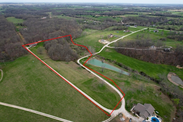 bird's eye view featuring a rural view and a water view