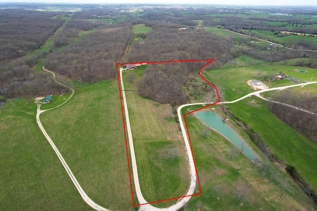 aerial view with a water view and a rural view