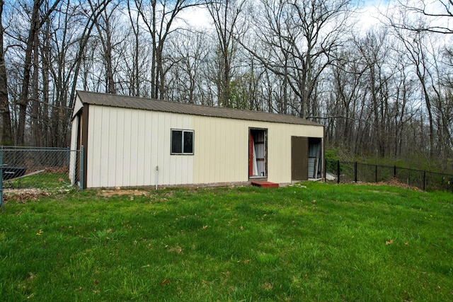 view of outbuilding featuring an outbuilding and fence