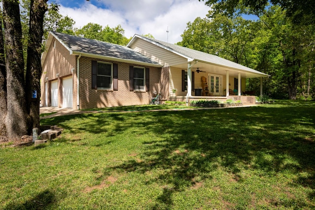 1219 County Road 6170, West Plains, MO 65775 - view of front facade featuring brick siding, ceiling fan, a porch, a front yard, and french doors