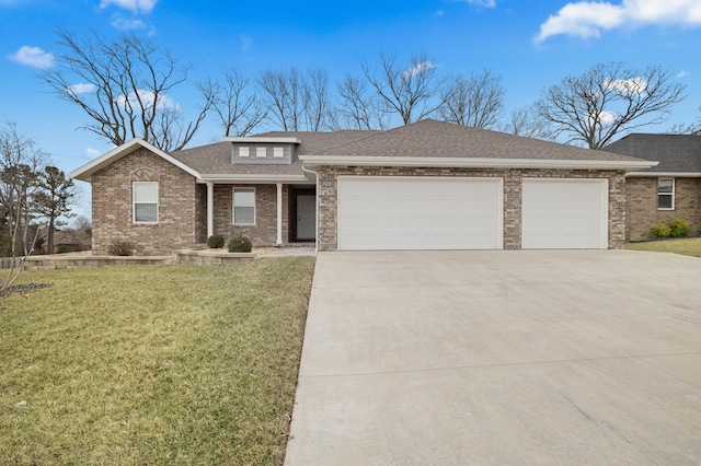 view of front facade with a garage and a front lawn