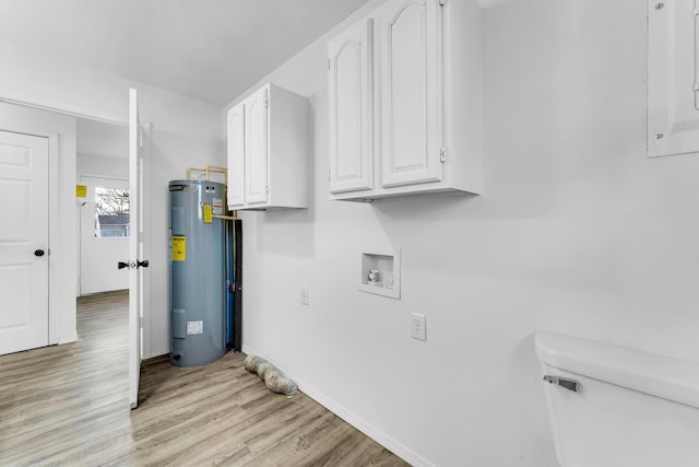 clothes washing area featuring water heater, electric panel, washer hookup, electric dryer hookup, and light wood-type flooring