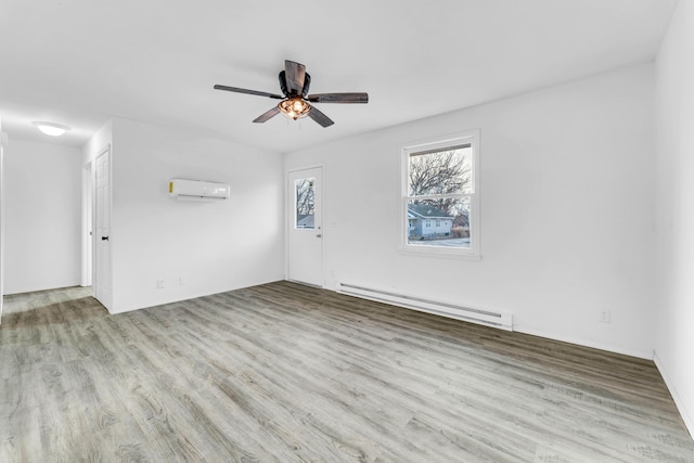 unfurnished room featuring light hardwood / wood-style flooring, ceiling fan, a baseboard heating unit, and a wall mounted AC