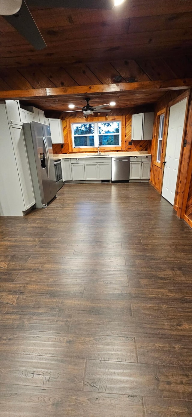 11498 Weatherman Dr, Mountain Grove, MO 65711 - kitchen with stainless steel appliances, wood ceiling, a sink, dark wood-type flooring, and wood walls