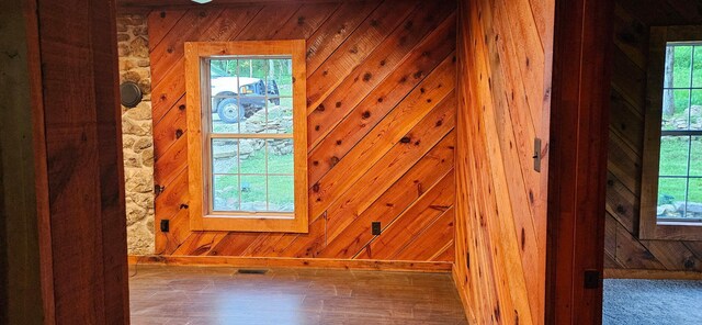 11498 Weatherman Dr, Mountain Grove, MO 65711 - spare room featuring wood walls, baseboards, and wood finished floors