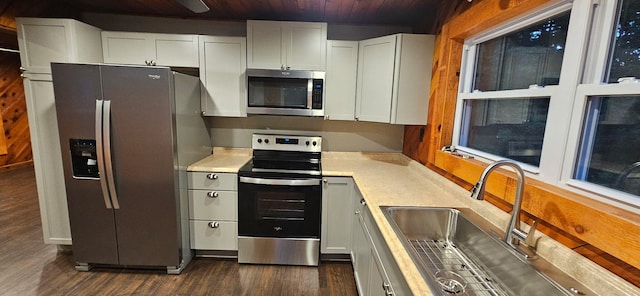 11498 Weatherman Dr, Mountain Grove, MO 65711 - kitchen with appliances with stainless steel finishes, a sink, wood ceiling, light countertops, and dark wood-style floors