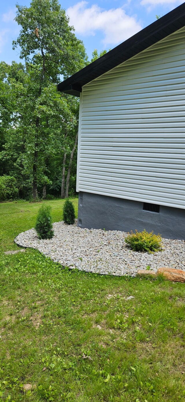 11498 Weatherman Dr, Mountain Grove, MO 65711 - view of property exterior featuring a lawn and crawl space