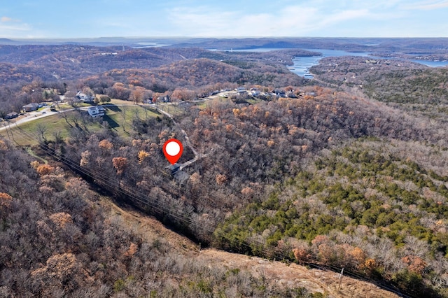 aerial view featuring a wooded view