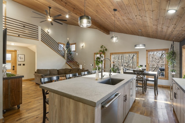 kitchen with a sink, white cabinetry, dark wood-type flooring, and dishwasher