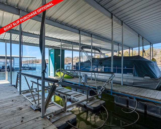 dock area with a water view and boat lift