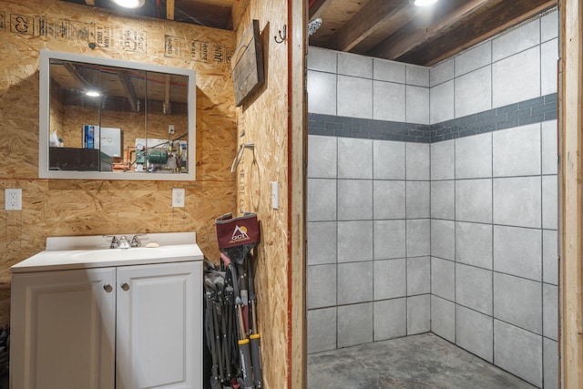 bathroom with concrete floors and vanity