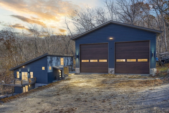 garage at dusk featuring a garage