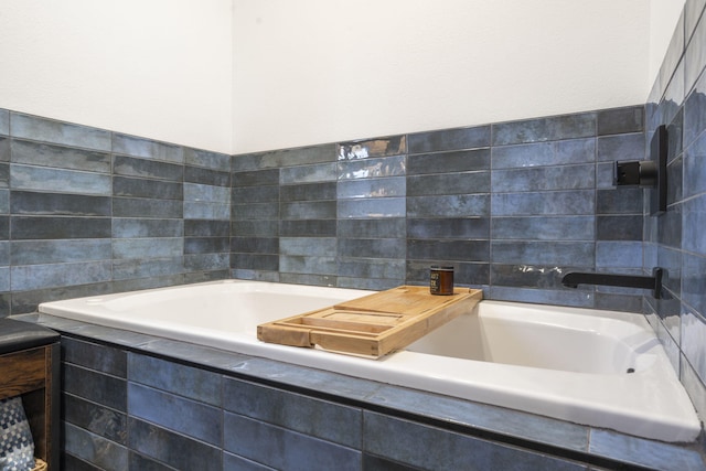 full bathroom with tile walls and a bath