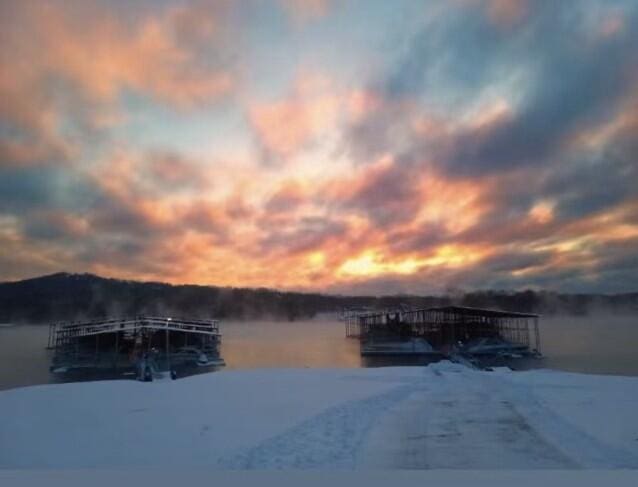 view of dock with a water view