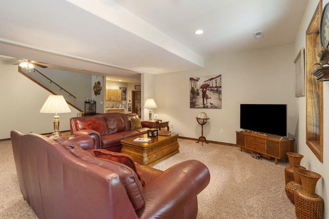 living room featuring recessed lighting, baseboards, a ceiling fan, and light colored carpet