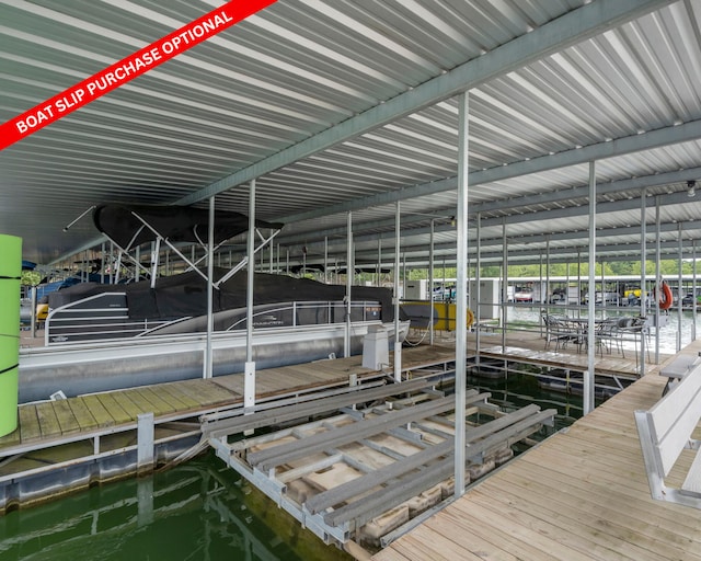 dock area with a water view and boat lift