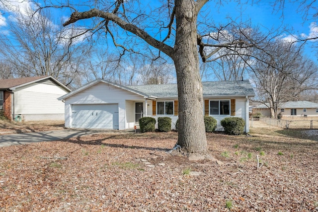 single story home featuring a garage