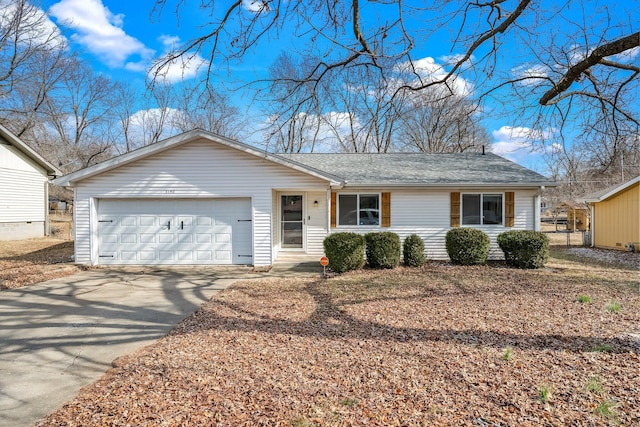 ranch-style house featuring a garage