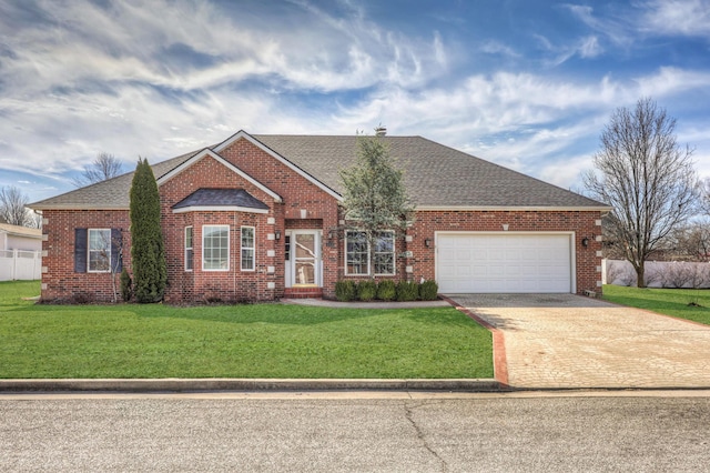 view of front facade featuring driveway, a front lawn, a shingled roof, and brick siding