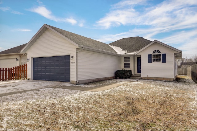 single story home featuring a garage