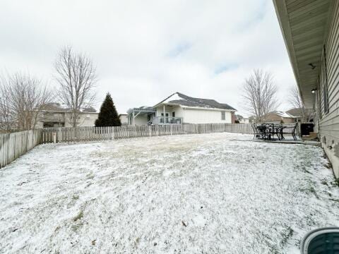 view of yard covered in snow