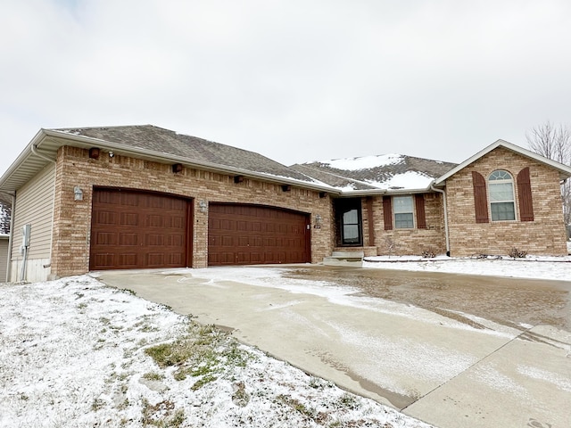 ranch-style house featuring a garage