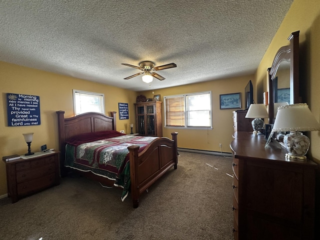carpeted bedroom featuring ceiling fan, multiple windows, baseboard heating, and a textured ceiling