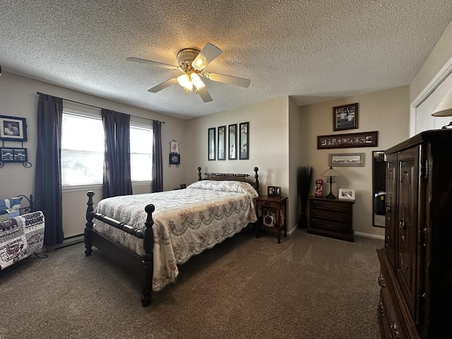 bedroom with carpet floors, a textured ceiling, baseboards, and a ceiling fan