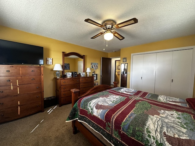 carpeted bedroom featuring a ceiling fan, a closet, and a textured ceiling