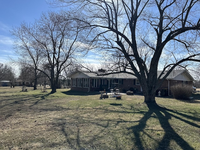 view of yard featuring a sunroom