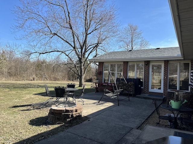 view of patio / terrace with a fire pit