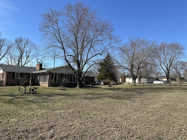 view of yard featuring a sunroom