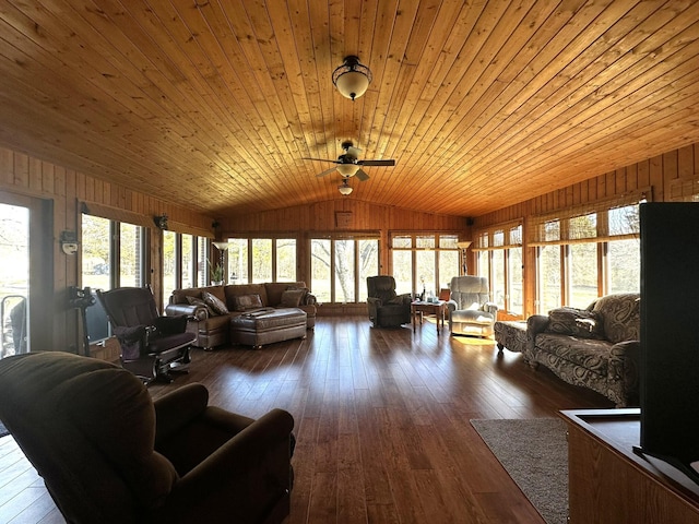 living room with vaulted ceiling, wooden walls, ceiling fan, wooden ceiling, and hardwood / wood-style floors